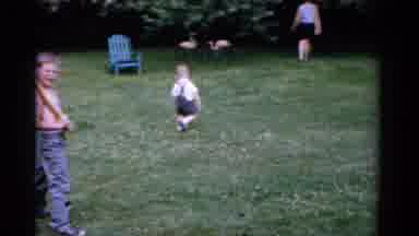 Florida USA (1975): A Mother And Her Two Young Children Playing Baseball In The