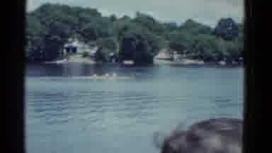 Boston Mass USA (1975): Crew Race On River With Three Boats Going By While Man And