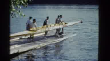 Boston Mass USA (1975): People Lifting A Small Boat Together And Getting Out Of