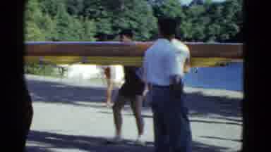 Boston Mass USA (1975): Rowing Team Carrying Their Boat Away From The Lake After A