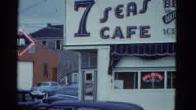 Boston Mass USA (1975): 7 Seas Cafe Sign Over A Cafe With Old Cars From The 50s