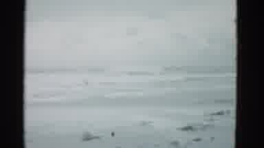 Boston Mass USA (1975): View Of Ocean Tide At Empty Beach On A Cloudy Day