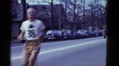 Boston Mass USA (1975): Male Runners Pacing Themselves As They Run A Marathon On A