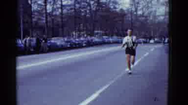 Boston Mass USA (1975): Black Shirt Man Running Yellow Shirt Man Running On The