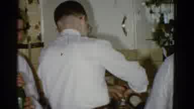 Boston Mass USA-1975: Man Holding A Drink Laughs As Another Pours Himself A