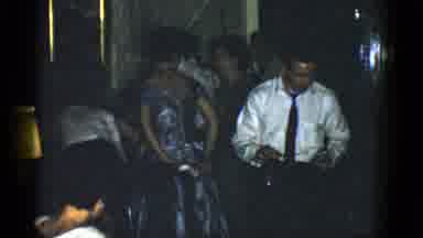 Boston Mass USA (1975): Man Wearing White Shirt With Red Tie Looking For Place To