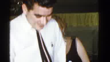 Boston Mass USA (1975): Man And Woman Hold Heads Together Before Sitting Down At