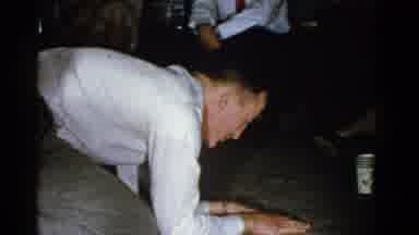 Boston Mass USA (1975): White Man In White Shirt Kneeling On The Ground Kisses The