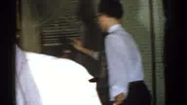 Boston Mass USA (1975): A Man Wearing Glasses Standing Up And Talking To A Group