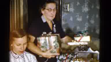 Boston Mass USA (1975): Woman Wearing Glasses And Placing Wrapped Packages On The