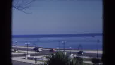 Florida USA (1975): A View Of Cars Driving On Street Surrounded By Water
