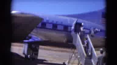 Florida USA-1975: People Board A Shiny Silver Pan Am Plane On The Runway