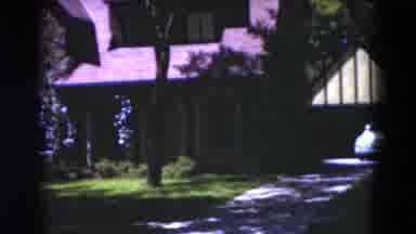 Florida USA (1975): A Woman Standing In A Dark Background In Front Of A Large