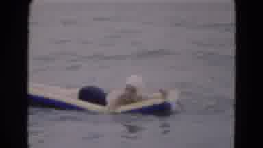 Florida USA (1975): Woman On An Inflatable Raft Falling Into The Water As She