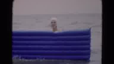 Florida USA (1975): Vintage Clip Of Woman At The Beach Playing With A Blue And