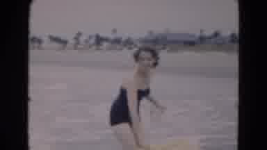 Florida USA (1975): A Woman Uses A Raft At The Beach In Her Bathing Suit