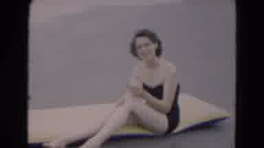 Florida USA (1975): A Lady Sitting On Board And Another Lady Floating On Board In