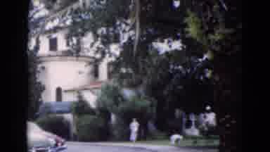 Florida USA (1975): Woman Walks Down The Walkway Away From The Tall Building