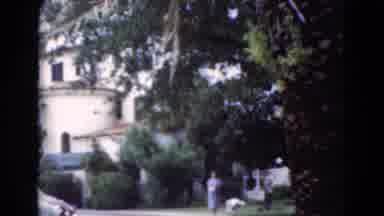 Florida USA (1975): Gardners Diligently Work On Chateau's Grounds As Women