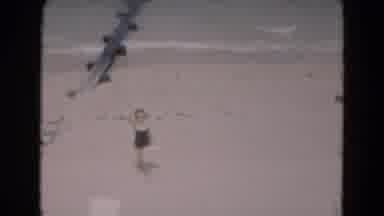 Florida USA (1975): Woman In A Black Bathing Suit Waving At Someone While Spending