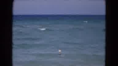 Florida USA (1975): Lady Taking A Swim In The Ocean On A Bright Sunny Day