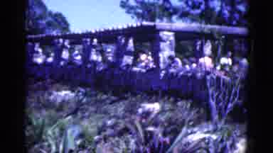 Florida USA (1975): People Gather And Walk Around Outside In Front Of Tall Rock