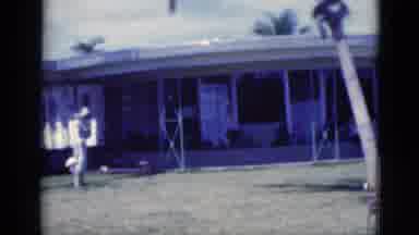 Florida USA (1975): A View Of A Lady Walking Around Her House And Alligators On