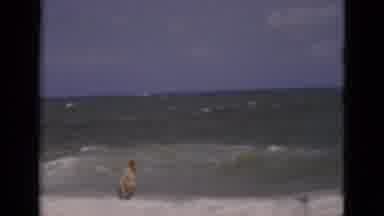 Florida USA (1975): Middle-Aged White Man In Shorts Wading Into The Ocean Surf
