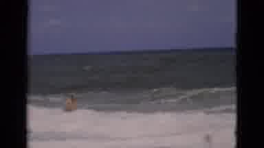 Florida USA (1975): A Video Of A Man Swimming And Having Fun On Waves