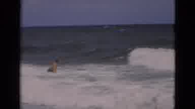 Florida USA (1975): Fat Man Plays At The Beach As The Tides Roll In View Shifts To