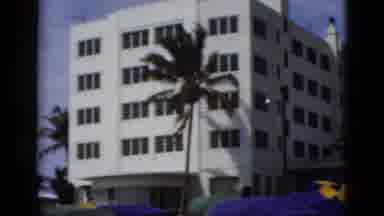 Florida USA (1975): Beach Tent Shades On A Summer Day With A Busy Street And Large