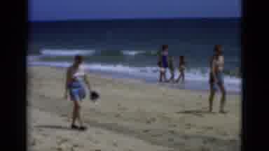 Florida USA (1975): People Walking And Swimming On The Beach