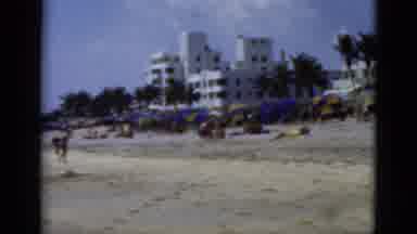 Florida USA (1975): A Crowd Of People Enjoy A Day Out On The Beach On A Sunny Day