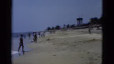 Florida USA (1975): Beach Scene With Many People Wading In The Calm Surf While