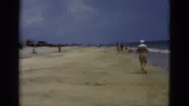 Florida USA (1975): People Walking Summer On The Beach Wind Sand Children Adults