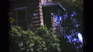 Florida USA (1975): Camera Pans Up A Red Brick House Covered With Many Green Vines