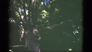 Florida USA (1951): Woman Wearing Pink Suit Walks Down Stone Steps On A Sunny Day