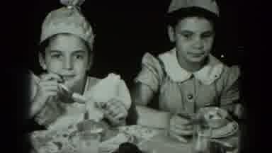 West Germany (1951): Children Wearing Party Hats Pause From Eating Ice Cream And