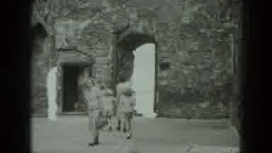West Germany (1951): Family Views A Stone Building While On Vacation With Everyone
