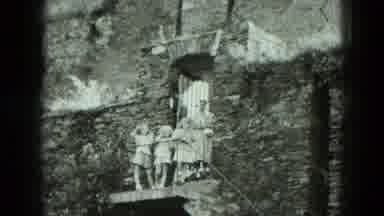 West Germany (1951): Vintage Woman And Three Girls Waving Outside Of Stone