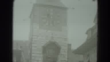 West Germany (1951): Looking At Church Down The Street And Looking Up At The Clock