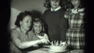 West Germany (1951): A Woman Cut A Cake And All Three Children See It With A Laugh