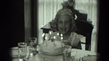 West Germany (1951): A Child Is Blowing The Candles In The Cake On Her Birthday