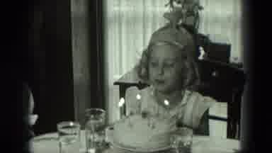 West Germany (1951): A Little Girl Blows Puts Out Candles On Her Birthday Cake