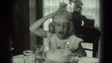 West Germany (1951): Little Girl Blowing Out Birthday Candles On Her Cake