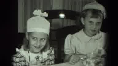 West Germany (1951): Children Wearing Party Hats While Eating Cake And Ice Cream