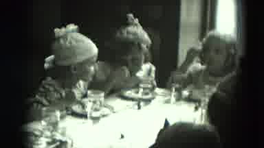 West Germany (1951): Five Kids Sitting Around The Dinner Table Eating And Laughing