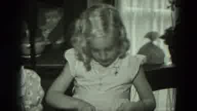 West Germany (1951): Young Girl Picks Up A Bracelet Around Other Children