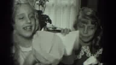 West Germany (1951): Laughing Girl Looks At And Shows Card To Others Gathered