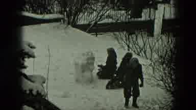 West Germany (1951): Group Of Young Adults And Dog Playing Outdoors In The Snow